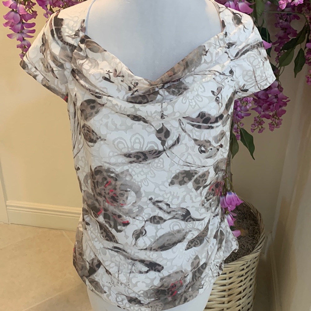 Beautiful top perfect under suits or to dress up with a skirt